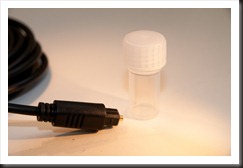 Toslink cable end with small vial for casting